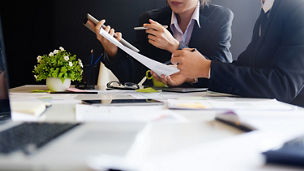 Business people going through documents