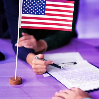 Desk with papers and American flag