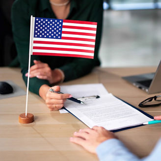 Desk with papers and American flag