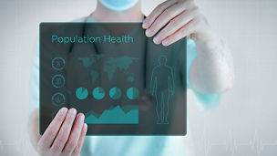 A man holds the board with the text of population health