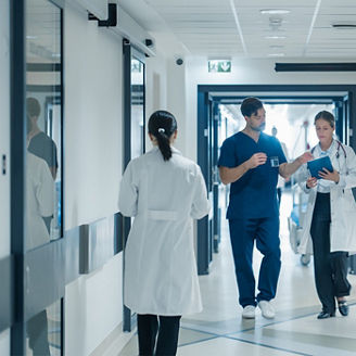 Hospital hallway with doctors and nurses
