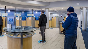 woman looking up in forest