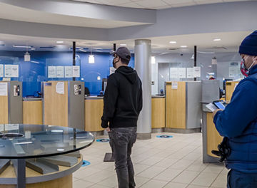 woman looking up in forest