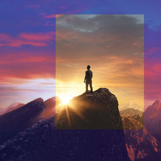 man-standing-on-mountain