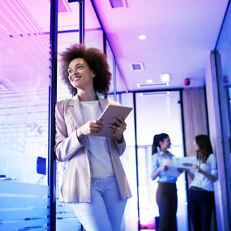 Portrait of a happy young black business woman smiling