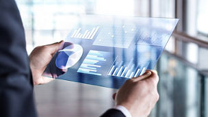 A person is looking at the sustainability reporting on a tablet.