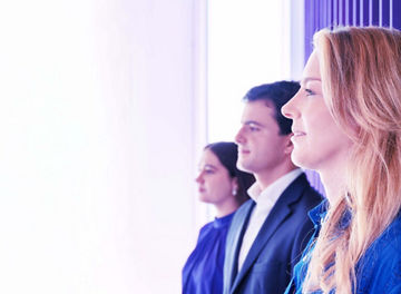 3 smiling colleagues