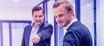 Two man looking down