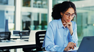 Internal audit professional working at desk