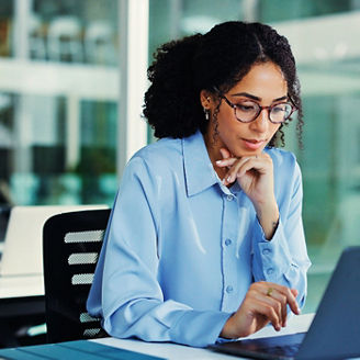 Internal audit professional working at desk