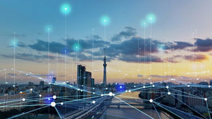 Modern city skyline with high-rise buildings at sunset