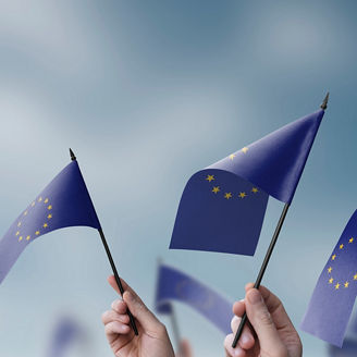 People waving with EU flags