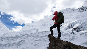 A man climbing a mountain