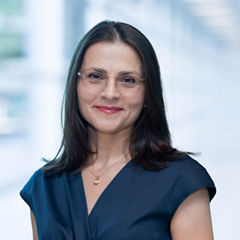 Blurred abstract background interior view looking out toward to empty office lobby and entrance doors and glass curtain wall with frame
