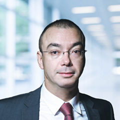 Blurred abstract background interior view looking out toward to empty office lobby and entrance doors and glass curtain wall with frame