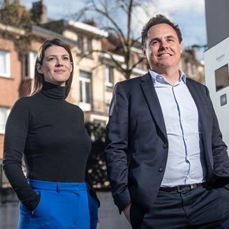 2 employees of KPMG in Belgium looking far away