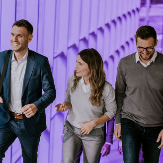 Office employees chatting on their way to work