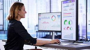 Woman looking at data on screen