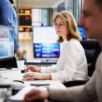 Businesswomen looking at dashboards