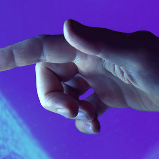 Human hand reaching for data