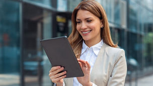 Man working with AI software on tablet