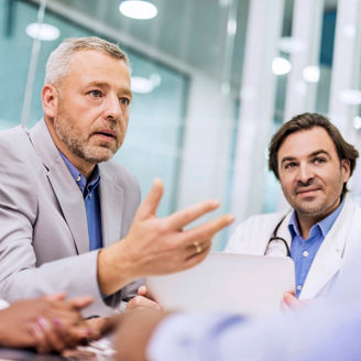 Businessman on a meeting with doctors.