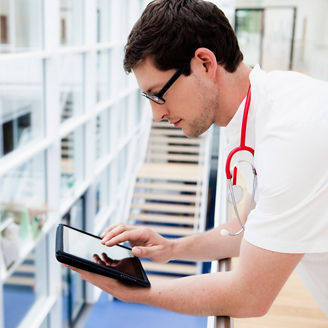 Germany, Bavaria, Diessen am Ammersee, Young doctor using digital tablet