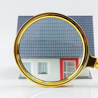 Magnifying glass in front of the house