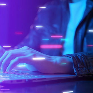 A man typing on laptop