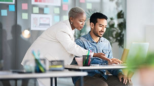 Office laptop, diversity and business people reading online report, website design feedback or research project. Collaboration, staff mentor and team designer working on company homepage development.