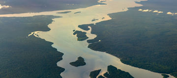 The Essequibo and Cuyuni rivers in the Amazon rainforest of Guyana at sunset. South America, The Essequibo and Cuyuni rivers in the Amazon rainforest of Guyana at sunset. South America