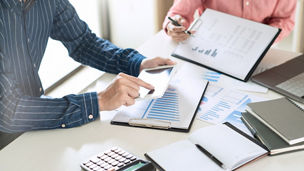 Business Team Entrepreneur discussing and analysis report chart data in office, brainstorming in Meeting and successful teamwork Concept