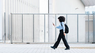 portrait of a beautiful black woman using her smartphone