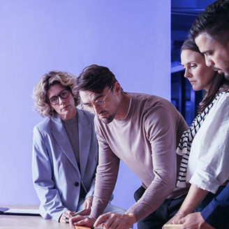 Girl smiling in a group meeting