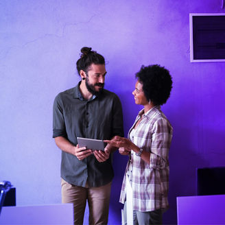 Two people looking at tablet