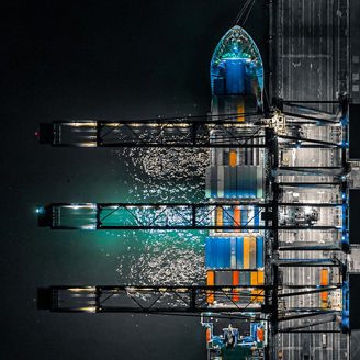 Aerial view of container cargo ship at night