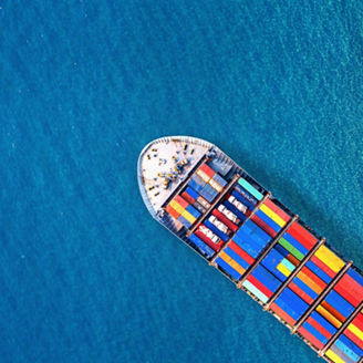 Aerial view of container cargo ship in sea.