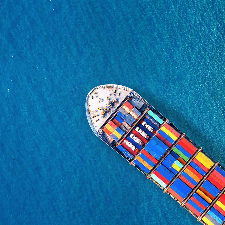 Aerial view of container cargo ship in sea.