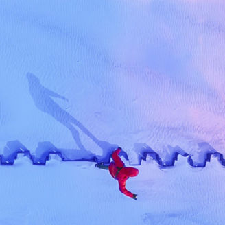 man waking in the snow 