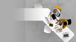 Aerial view of two business people together working on a project