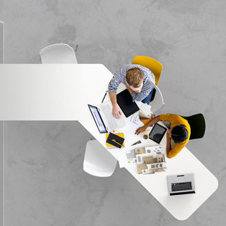 Aerial view of two business people together working on a project