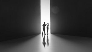 Woman and man black and white hallway