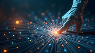 A person looking at a laptop on a desk with digital graphics