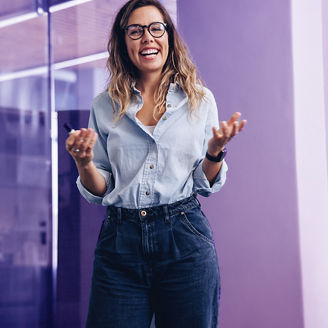 Accomplished team leader receiving an applause from her colleagues at the end of her business presentation. Successful businesswoman smiling happily, celebrating her hard work with her team.; Shutterstock ID 2398222029; purchase_order: Advisory assurance; job: anne; client: Future of audit campagne