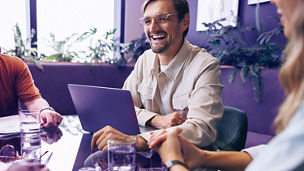 Successful business team meeting in a corporate boardroom, discussing current projects and sharing updates. Happy business people working together to achieve productive results for their company.; Shutterstock ID 2480093785; purchase_order: Advisory assurance; job: anne; client: Future of audit campagne