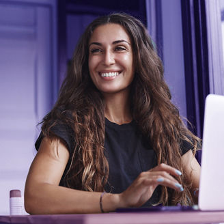 Young businesswoman manage business from home on remote, freelancer using laptop sit kitchen table on self-quarantine, work over personal growth, apply for online courses to learn new skills; Shutterstock ID 1704131167; purchase_order: advisory assurance; job: anne; client: ai