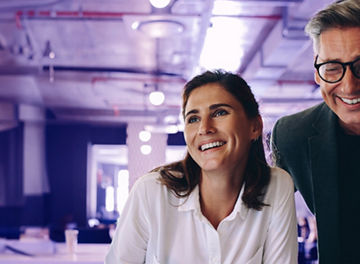 Man and woman at a laptop
