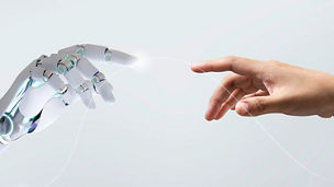Human and robot hand together in harmony