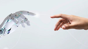 Human and robot hand together in harmony