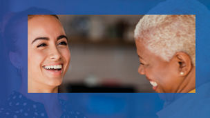 Two woman laughing with eachother